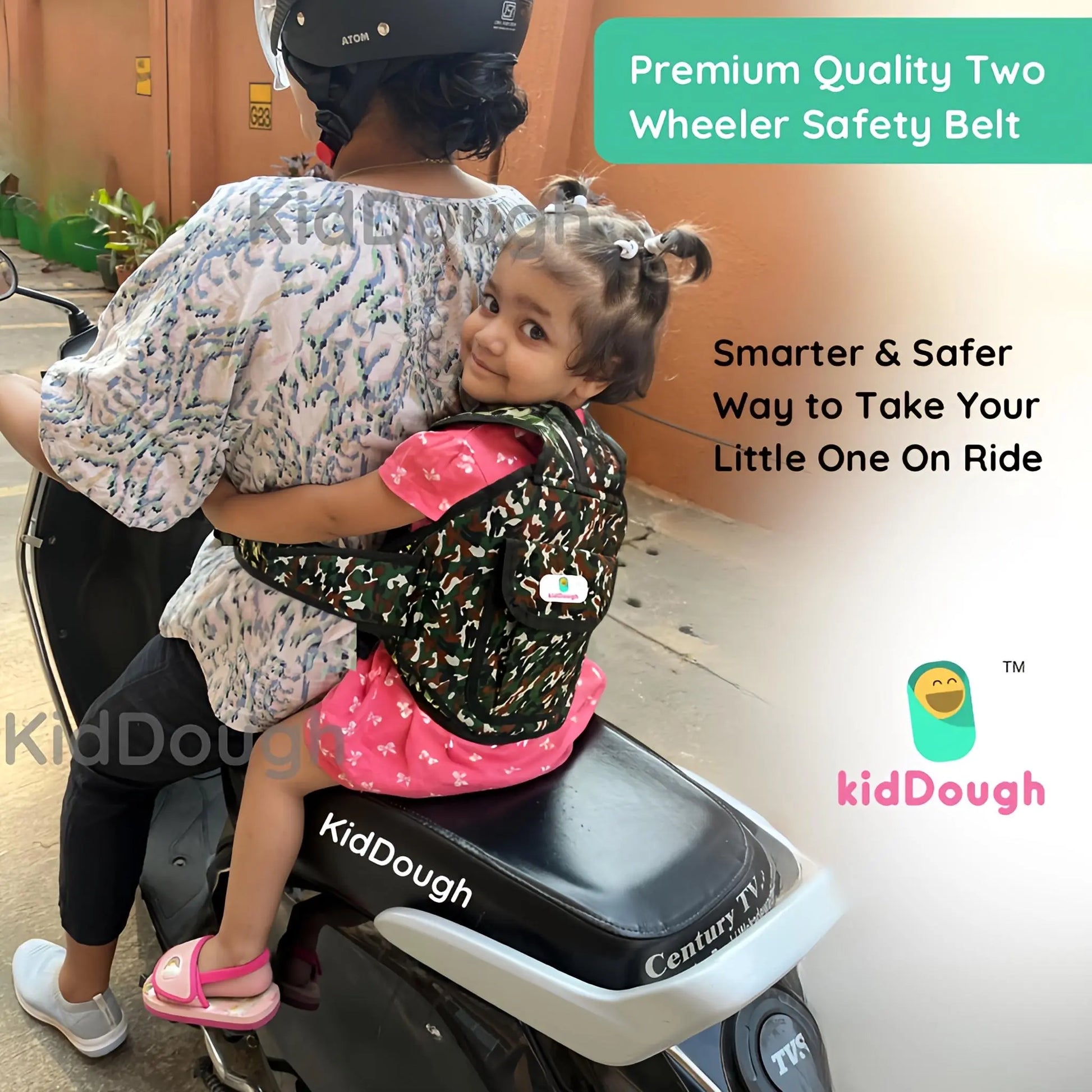 Child being securely held by an adult on a scooter with a 'KidDough' safety belt, promoting safety and quality.